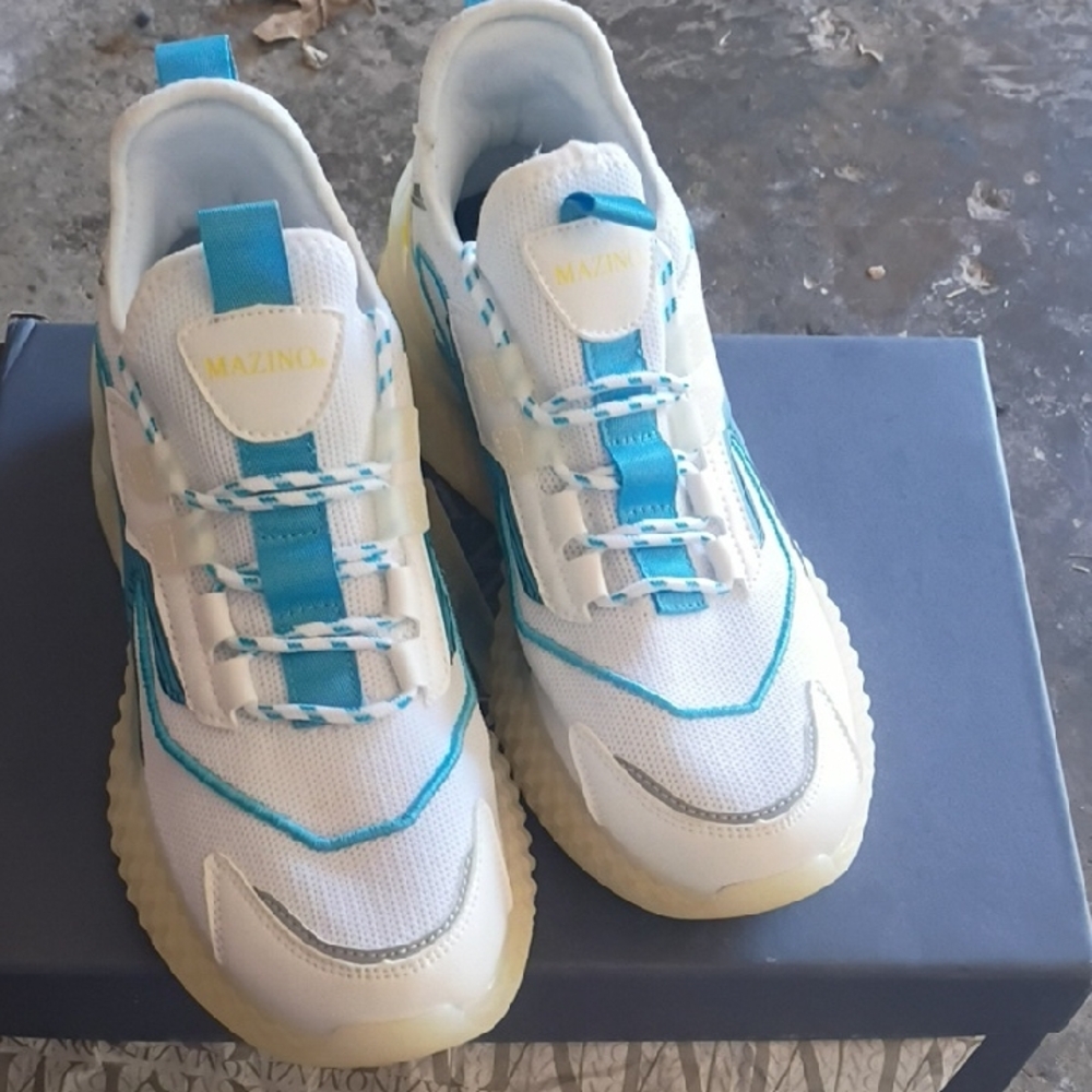 White and Blue Athletic Shoes with Yellow Accents